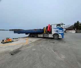 Barge on to a hook loader truck